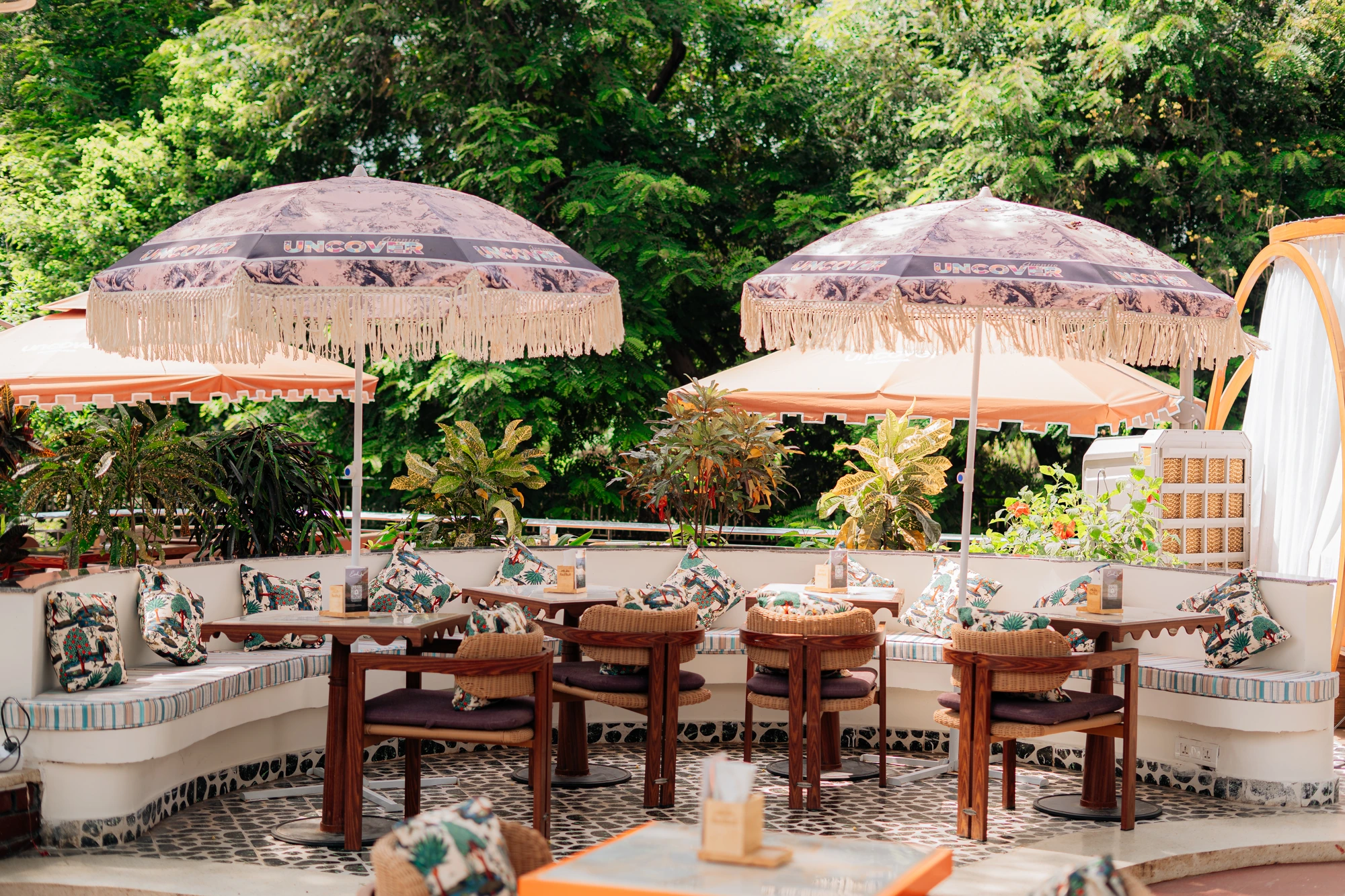 Garden seating under Uncover umbrellas