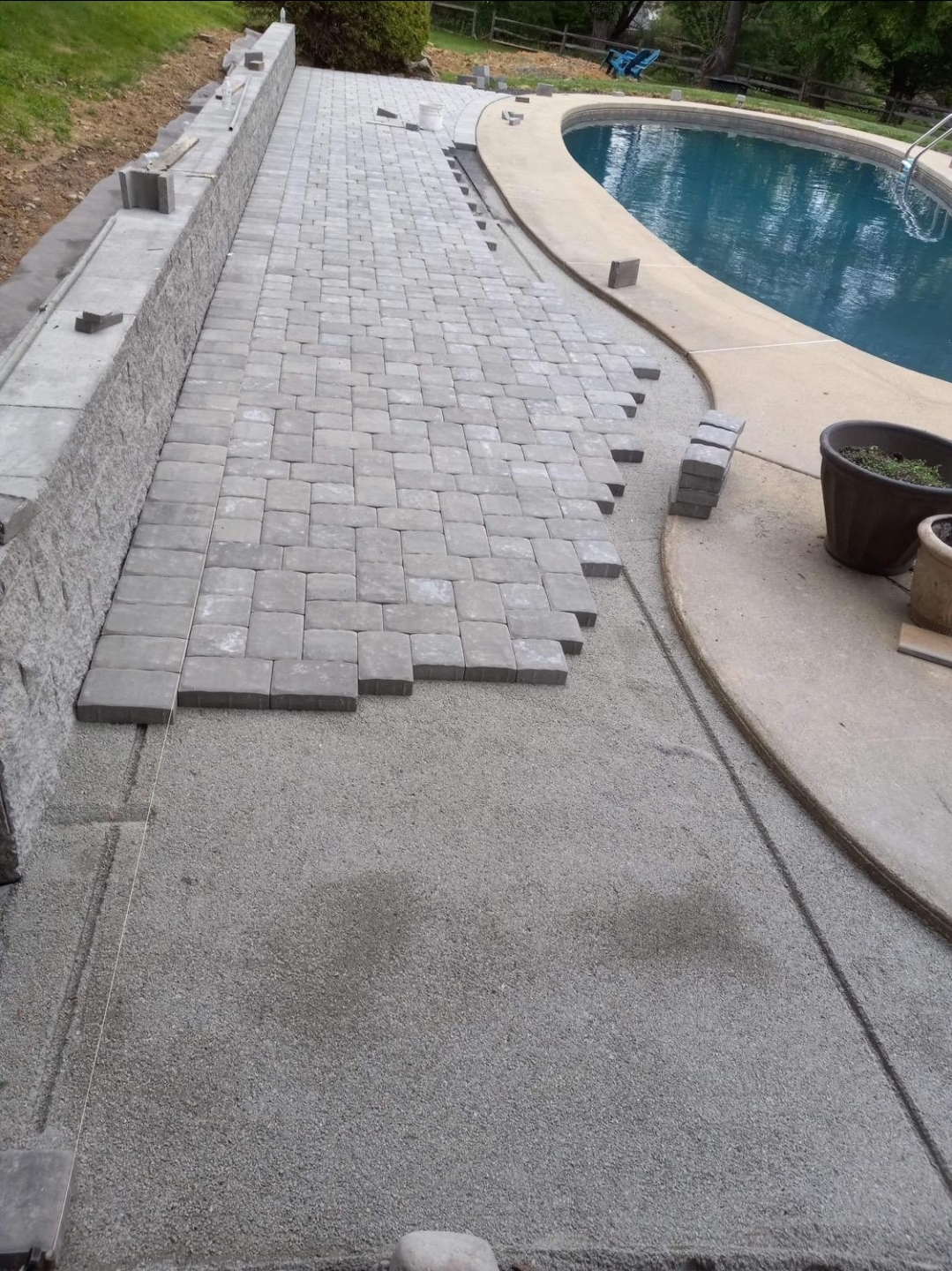Completed patterned flagstone walkway with a stone planting border