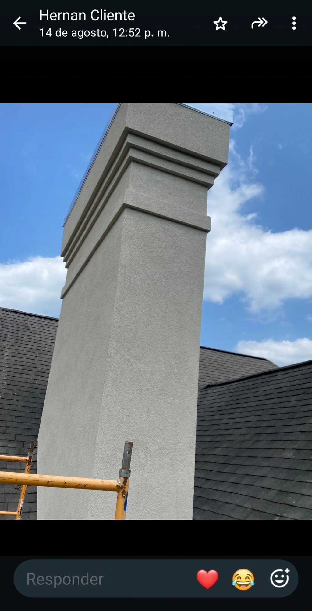 Completed light stucco chimney and roof exterior