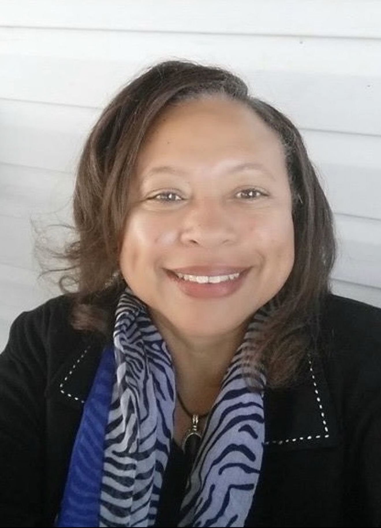 Warm portrait of a smiling woman — resident featured for Inner Strength & Case Management