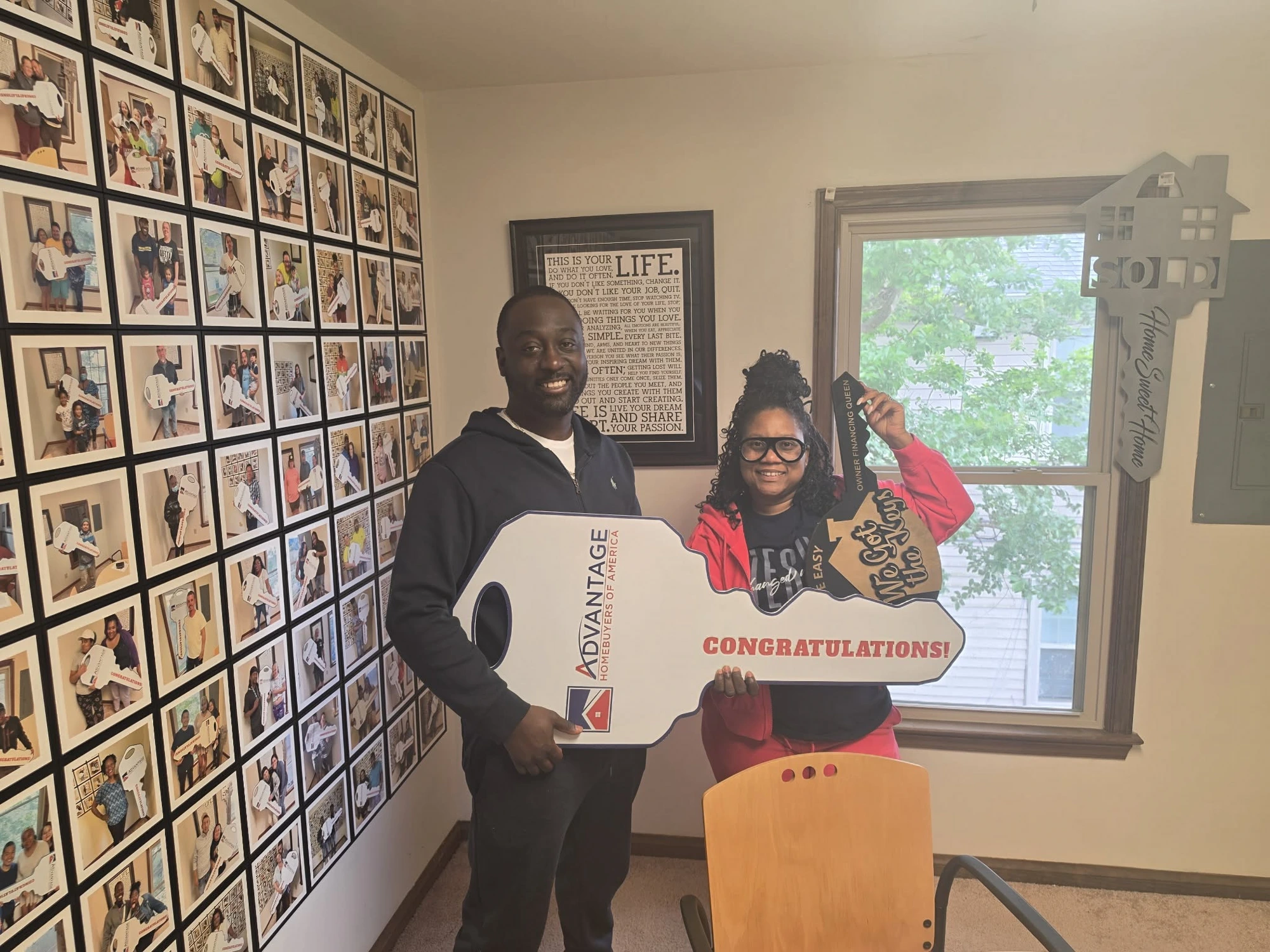 Pastor Jewel and her husband receiving the keys to the foster care home