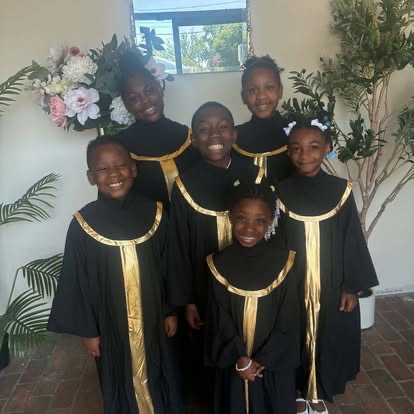 Greater Faith youth choir in black and gold robes
