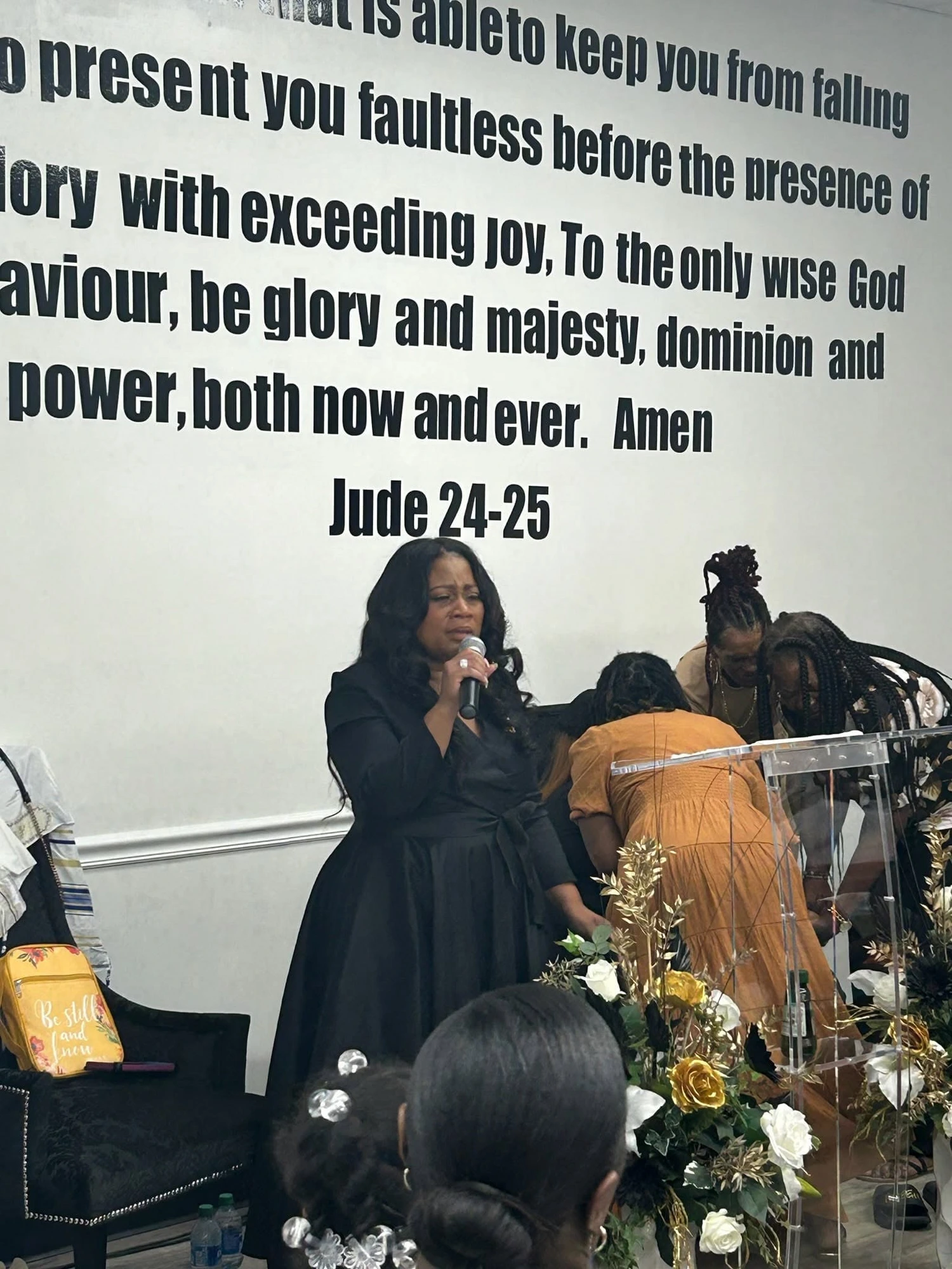 Pastor Jewel Jones ministering at the altar