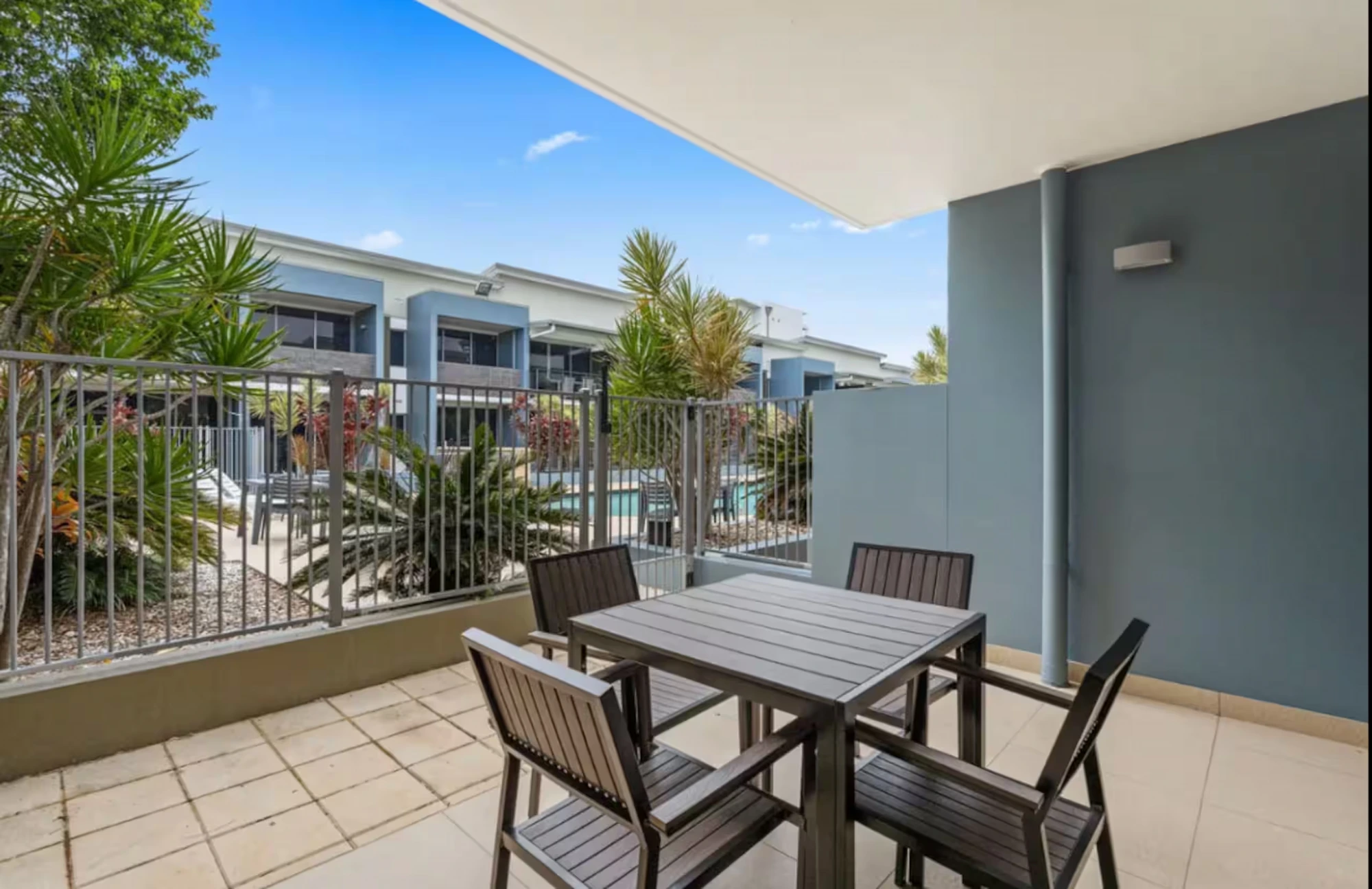 Living area opening to the terrace at Migaloo, Ramada Resort Urangan, Hervey Bay — photo 4 of 8