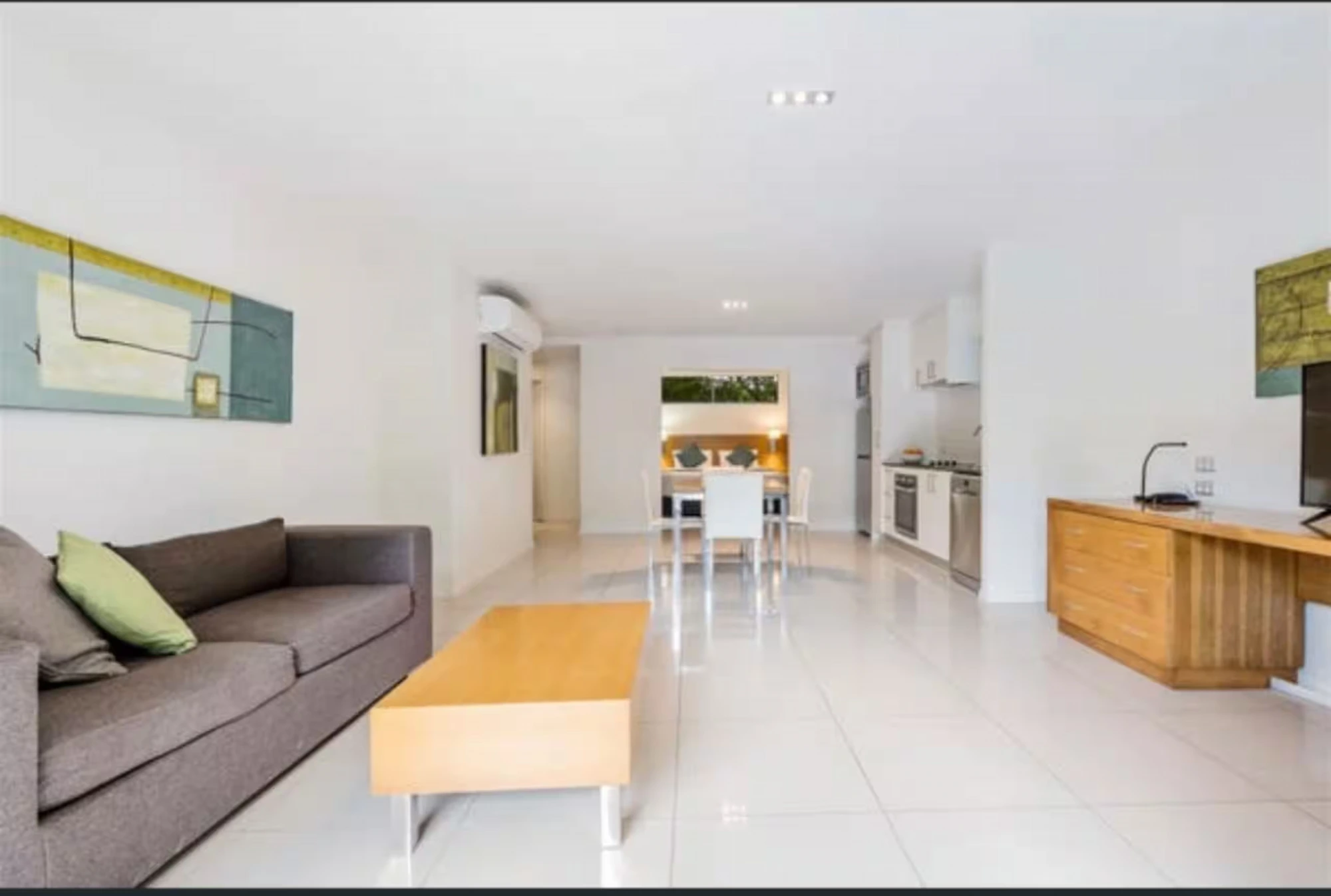 Living area opening to the terrace at Migaloo, Ramada Resort Urangan, Hervey Bay — photo 5 of 8
