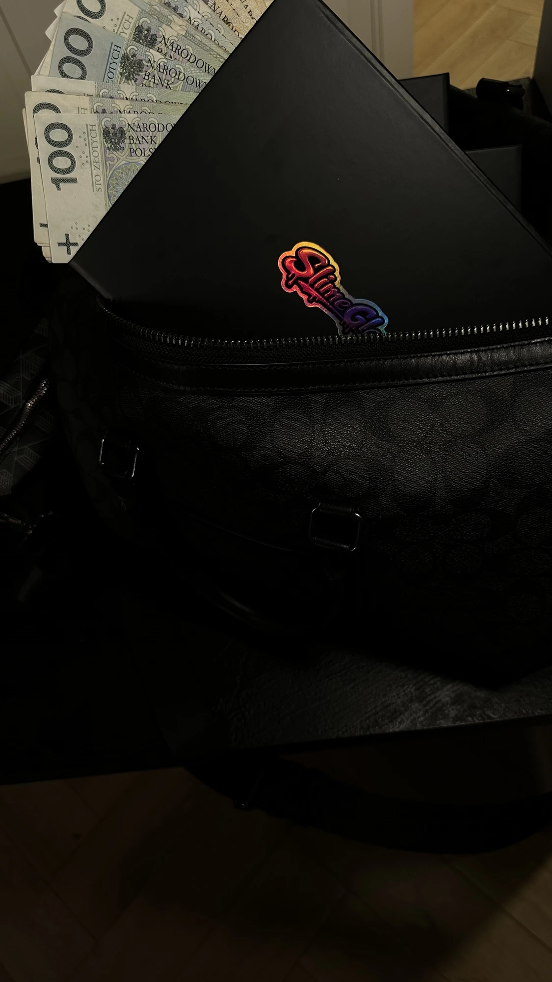 SlimeGlass box and cash in a designer bag